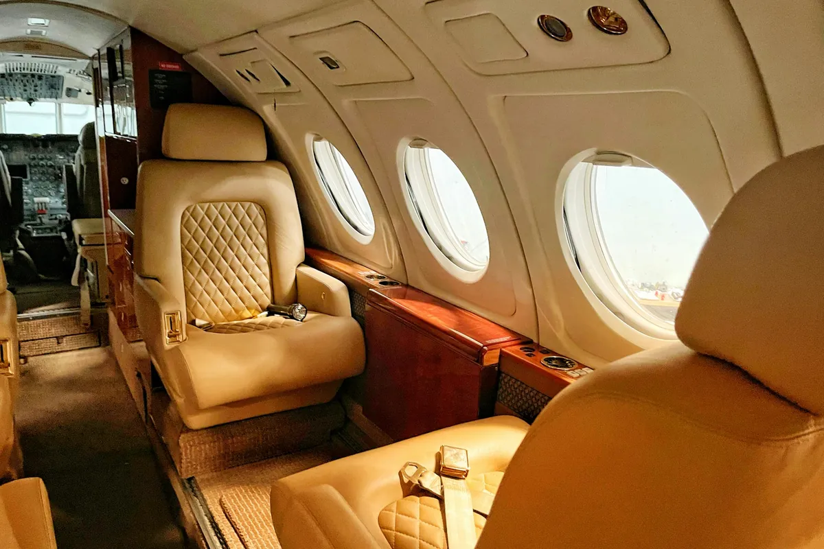 Quilted tan leather seats in a private jet